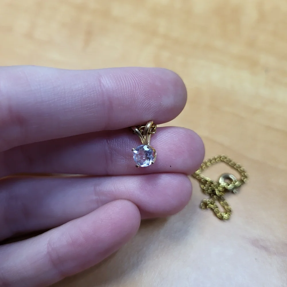 Elegant Gold Necklace with Purple Pendant